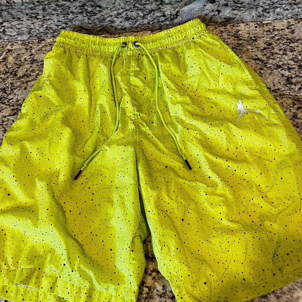 Jordan brand shorts.  2 pairs size L. 1 pair is gray and 1 pair is neon yellow.